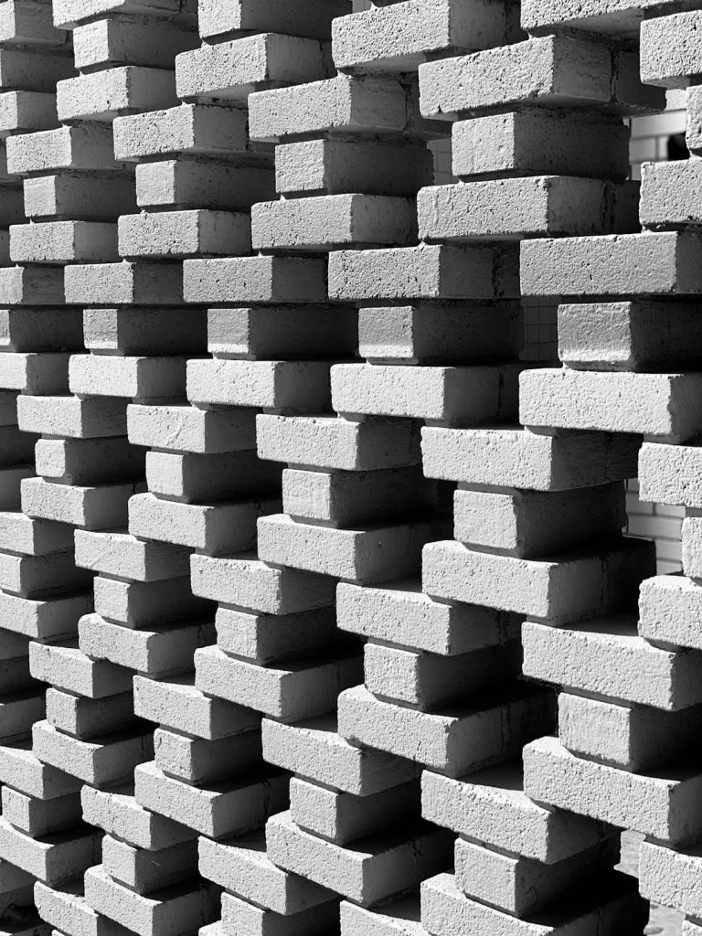 black-and-white-photograph-of-a-stack-of-bricks-w4oq6zpuzka